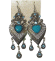 Boucles d'oreilles pendantes en metal argente delicatement cisele et orne de pierres turquoises format coeur