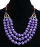 Collier ethnique artisanal trois rangs imitation pierres mauves et perles agencees de pieces argentees ciselees